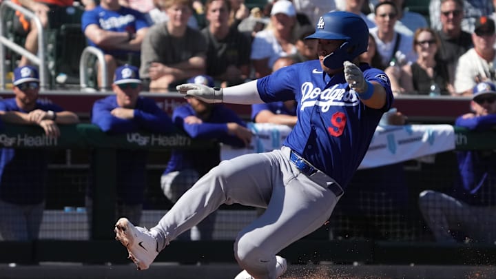 Feb 27, 2026; Scottsdale, Arizona, USA; Los Angeles Dodgers first baseman Keston Hiura (9) scores a run against the San Francisco Giants in the second inning at Scottsdale Stadium. Mandatory Credit: Rick Scuteri-Imagn Images