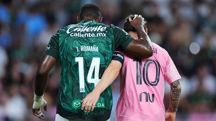 Club León's Jhohan Romaña and Inter Miami's Lionel Messi share a light moment during the teams' Leagues Cup match earlier this month.