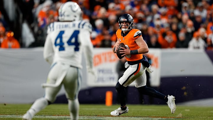 Dec 15, 2024; Denver, Colorado, USA; Denver Broncos quarterback Bo Nix (10) scrambles as Indianapolis Colts linebacker Zaire Franklin (44) defends in the third quarter at Empower Field at Mile High. 