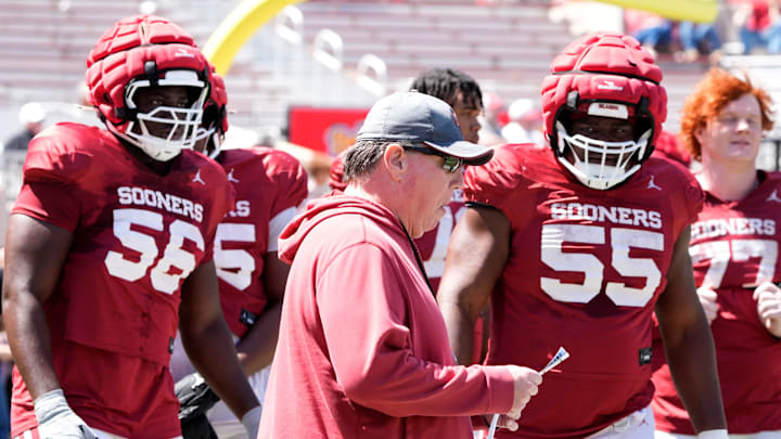 Oklahoma Offensive Line coach Bill Bedenbaugh, linemen Michael Fasusi and Eddy Pierre-Louis