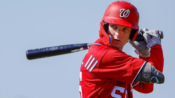 Feb 20, 2023; West Palm Beach, FL, USA; Washington Nationals outfielder Robert Hassell III (55) practices his swing during a spring training workout at The Ballpark of the Palm Beaches.