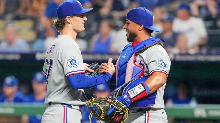 Texas Rangers pitcher Jacob Latz (67) celebrates with catcher Elias Díaz (35).