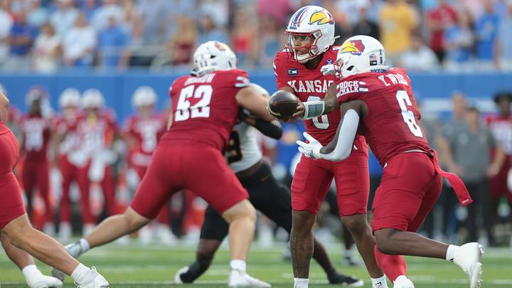 Kansas Jayhawks quarterback Isaiah Marshall (8) hands the ball to Kansas Jayhawks running back Yasin Willis (6) during the game inside David Booth Kansas Memorial Stadium on Sept. 11, 2026. Kansas Jayhawks quarterback Isaiah Marshall (8) hands the ball to Kansas Jayhawks running back Yasin Willis (6) during the game inside David Booth Kansas Memorial Stadium on Sept. 11, 2026.