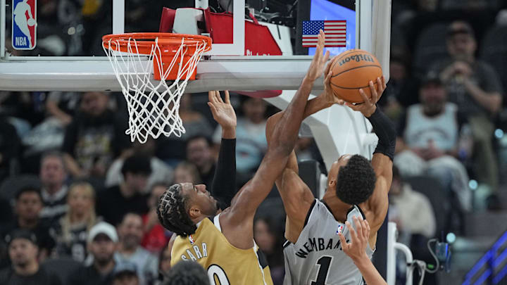 Dec 18, 2025; San Antonio, Texas, USA; Washington Wizards forward Alex Sarr (20) defends San Antonio Spurs forward Victor Wembanyama (1) during the second half at Frost Bank Center. Mandatory Credit: Scott Wachter-Imagn Images