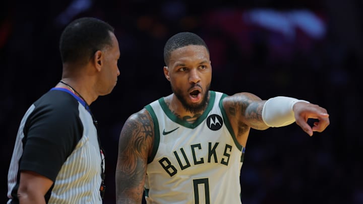 Nov 26, 2024; Miami, Florida, USA; Milwaukee Bucks guard Damian Lillard (0) talks to referee James Capers (19) during the third quarter at Kaseya Center. Mandatory Credit: Sam Navarro-Imagn Images