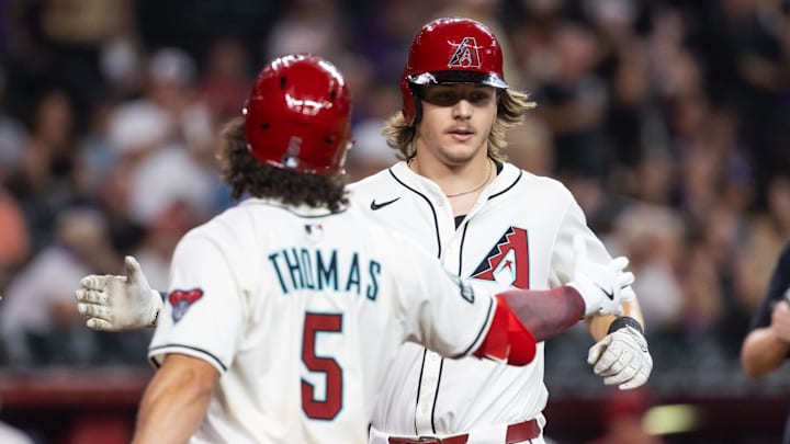 Aug 19, 2025; Phoenix, Arizona, USA; Arizona Diamondbacks outfielder Jake McCarthy (right) celebrates with teammate Alek Thomas after hitting a solo home run in the third inning against the Cleveland Guardians at Chase Field. Mandatory Credit: Mark J. Rebilas-Imagn Images Aug 19, 2025; Phoenix, Arizona, USA; Arizona Diamondbacks outfielder Jake McCarthy (right) celebrates with teammate Alek Thomas after hitting a solo home run in the third inning against the Cleveland Guardians at Chase Field. Mandatory Credit: Mark J. Rebilas-Imagn Images