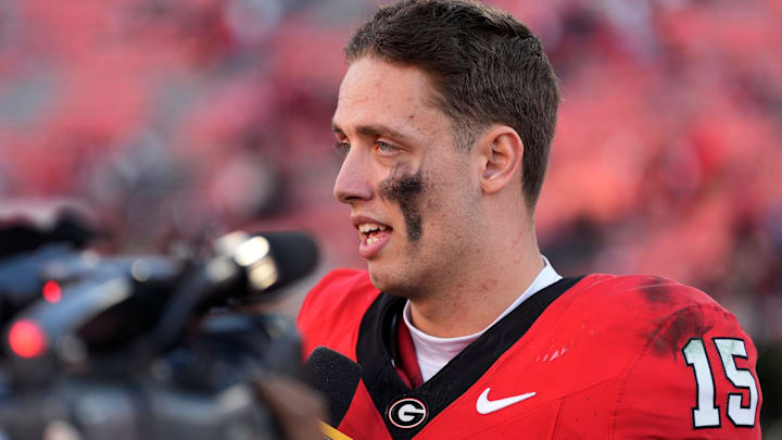 Then Georgia quarterback Carson Beck (15) speaks with the media after a NCAA college football game against Massachusetts.