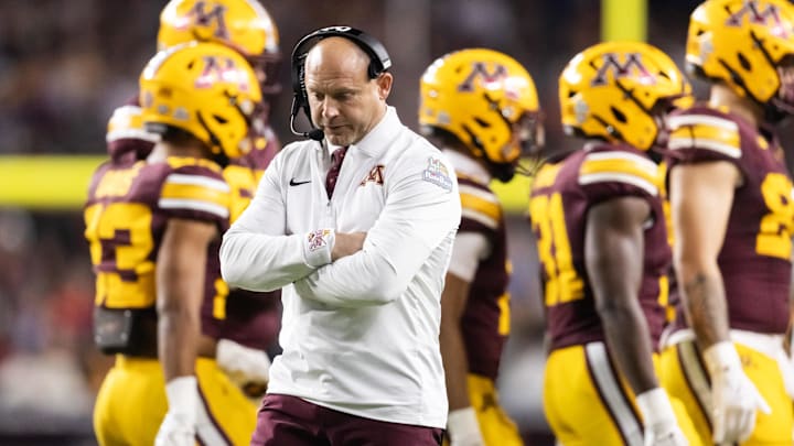 Dec 26, 2025; Phoenix, AZ, USA; Minnesota Golden Gophers head coach P.J. Fleck reacts against the New Mexico Lobos during the Rate Bowl at Chase Field. Mandatory Credit: Mark J. Rebilas-Imagn Images