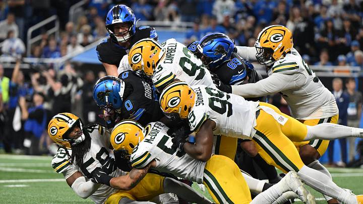 Oct 25, 2026; Detroit, Michigan, USA;  Detroit Lions running back Jahmyr Gibbs (0) is tackled during the fourth quarter against the Green Bay Packers at Ford Field.  Mandatory Credit: Lon Horwedel-Imagn Images