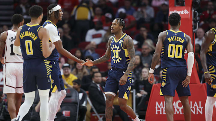 Nov 20, 2024; Houston, Texas, USA; Indiana Pacers guard Quenton Jackson (29) celebrates with center Myles Turner (33) after scoring during the first quarter against the Houston Rockets at Toyota Center. Mandatory Credit: Troy Taormina-Imagn Images