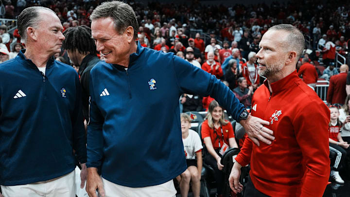 Kansas Jayhawks head coach Bill Self greets Louisville Cardinals head coach Pat Kelsey before the start of the exhibition game at the KFC Yum! Center in Louisville, Kentucky Friday, October 24, 2025. Kansas Jayhawks head coach Bill Self greets Louisville Cardinals head coach Pat Kelsey before the start of the exhibition game at the KFC Yum! Center in Louisville, Kentucky Friday, October 24, 2025.