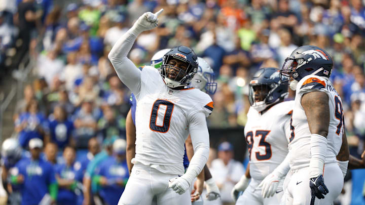 Sep 8, 2024; Seattle, Washington, USA; Denver Broncos linebacker Jonathon Cooper (0) celebrates following a sack against the Seattle Seahawks during the first quarter at Lumen Field. 