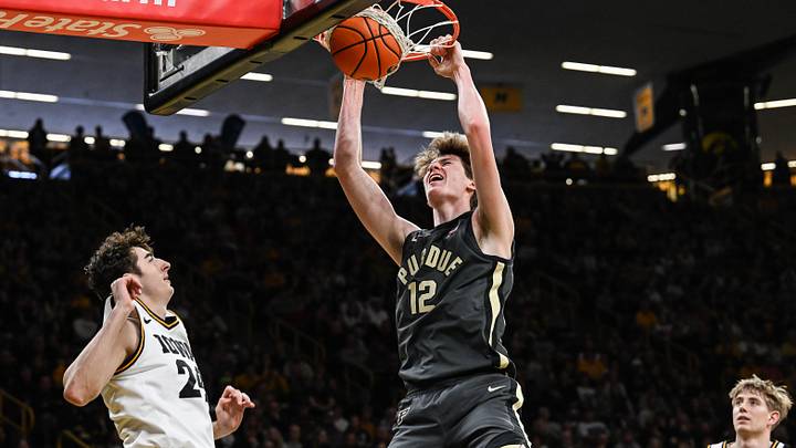 Purdue Boilermakers center Daniel Jacobsen (12) completes a slam dunk. Purdue Boilermakers center Daniel Jacobsen (12) completes a slam dunk.
