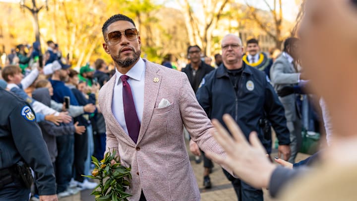 South Bend, Indiana, USA; Notre Dame Fighting Irish head coach Marcus Freeman greets fans while walking to the stadium before facing the Syracuse Orange at Notre Dame Stadium.