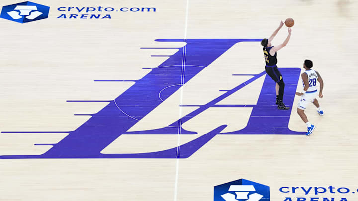 Nov 18, 2025; Los Angeles, California, USA; A general overall view as Los Angeles Lakers guard Austin Reaves (15) shoots the ball against Utah Jazz forward Brice Sensabaugh (28) on the LA City Edition logo at midcourt in the first quarter at Crypto.com Arena. Mandatory Credit: Kirby Lee-Imagn Images