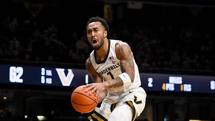 Dec 13, 2025; Nashville, Tennessee, USA;  Vanderbilt Commodores guard Frankie Collins (1) shoots over Central Arkansas Bears guard Luke Moore (32) during the second half at Memorial Gymnasium. Mandatory Credit: Steve Roberts-Imagn Images