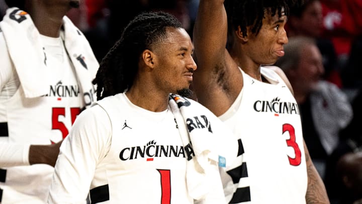 Cincinnati Bearcats guard Day Day Thomas (1) Cincinnati Bearcats guard-forward Rayvon Griffith (3) and Cincinnati Bearcats forward Aziz Bandaogo (55) looks on in the second half of a basketball scrimmage between Cincinnati Bearcats and Ohio State Buckeyes at Fifth Third Arena in Cincinnati on Friday, Oct. 18, 2024. Cincinnati Bearcats guard Day Day Thomas (1) Cincinnati Bearcats guard-forward Rayvon Griffith (3) and Cincinnati Bearcats forward Aziz Bandaogo (55) looks on in the second half of a basketball scrimmage between Cincinnati Bearcats and Ohio State Buckeyes at Fifth Third Arena in Cincinnati on Friday, Oct. 18, 2024.