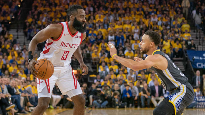 April 30, 2019; Oakland, CA, USA; Houston Rockets guard James Harden (13) dribbles the basketball against Golden State Warriors guard Stephen Curry (30) during the second quarter in game two of the second round of the 2019 NBA Playoffs at Oracle Arena. The Warriors defeated the Rockets 115-109. Mandatory Credit: Kyle Terada-USA TODAY Sports