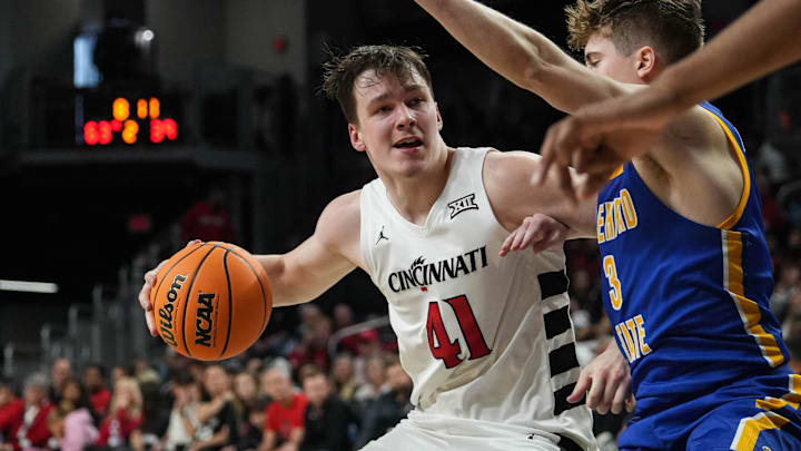 Bearcats Simas Lukosius (41) pushes through Morehead's defense during their game against the Morehead State Eagles at Fifth Third Arena on Friday November 8, 2024. Bearcats won the game with a final score of 83-56. Bearcats Simas Lukosius (41) pushes through Morehead's defense during their game against the Morehead State Eagles at Fifth Third Arena on Friday November 8, 2024. Bearcats won the game with a final score of 83-56.