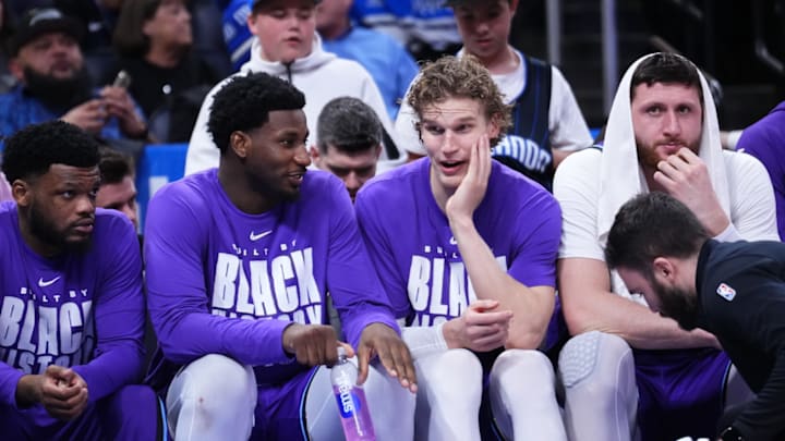 Jaren Jackson Jr. and Lauri Markkanen of the Utah Jazz sit on the bench in the second half against the Orlando Magic.
