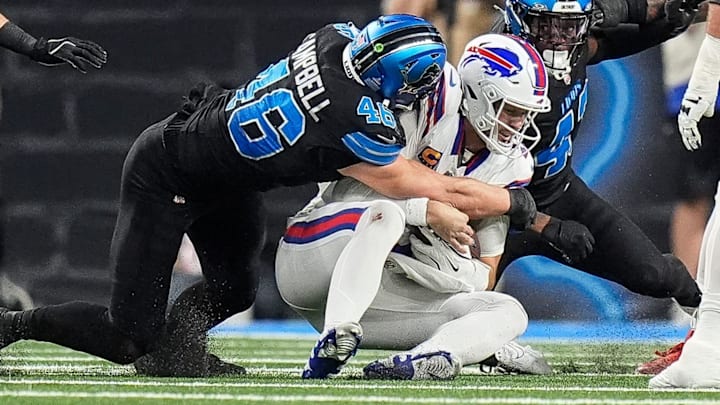 Detroit Lions linebacker Jack Campbell (46) tackles Buffalo Bills quarterback Josh Allen (17) during the first half at Ford Field in Detroit on Sunday, Dec. 15, 2024.