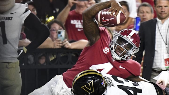 Sep 24, 2022; Tuscaloosa, Alabama, USA;  Vanderbilt Commodores linebacker De'Rickey Wright (43) drives Alabama Crimson Tide quarterback Jalen Milroe (4) out of bounds short of the goal line at Bryant-Denny Stadium. Alabama won 55-3. Mandatory Credit: Gary Cosby Jr.-Imagn Images
