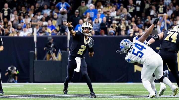 Dec 3, 2023; New Orleans, Louisiana, USA; New Orleans Saints quarterback Jameis Winston (2) passes the ball against Detroit Lions defensive tackle Alim McNeill (54) during the second half at the Caesars Superdome. Mandatory Credit: Stephen Lew-Imagn Images