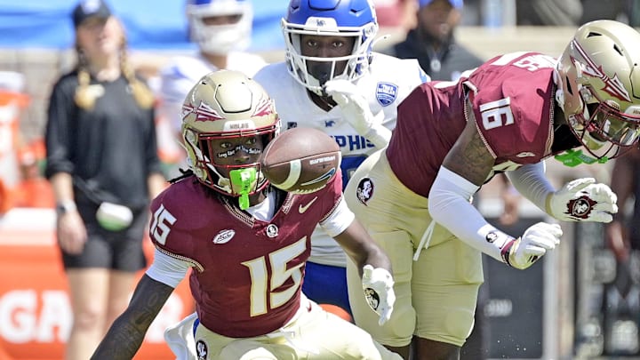 Sep 14, 2024; Tallahassee, Florida, USA; Florida State Seminoles wide receiver Lawayne McCoy (15) fumbles a punt return against the Memphis Tigers during the first half at Doak S. Campbell Stadium. Mandatory Credit: Melina Myers-Imagn Images