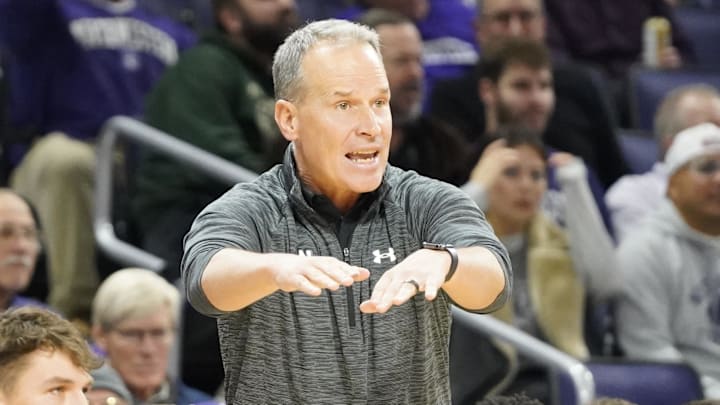 Nov 22, 2024; Evanston, Illinois, USA; Northwestern Wildcats head coach Chris Collins gestures to his team against the Pepperdine Waves during the first half at Welsh-Ryan Arena. Mandatory Credit: David Banks-Imagn Images Nov 22, 2024; Evanston, Illinois, USA; Northwestern Wildcats head coach Chris Collins gestures to his team against the Pepperdine Waves during the first half at Welsh-Ryan Arena. Mandatory Credit: David Banks-Imagn Images