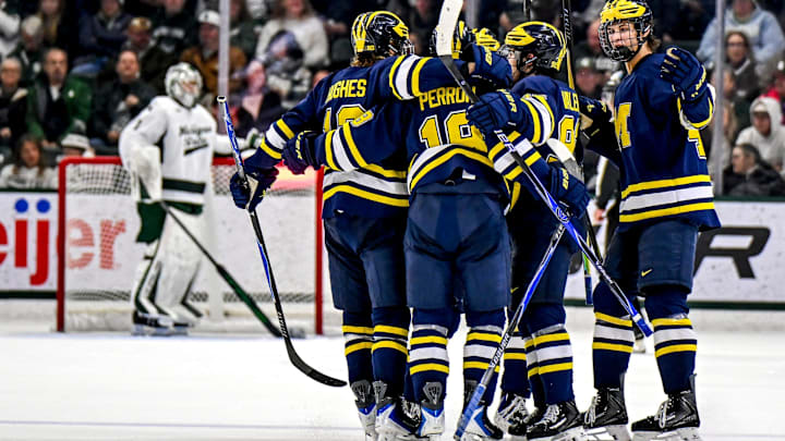 Michigan celebrates its third goal against Michigan State during the third period on Friday, Dec. 5, 2025, at Munn Ice Arena in East Lansing. Michigan celebrates its third goal against Michigan State during the third period on Friday, Dec. 5, 2025, at Munn Ice Arena in East Lansing.