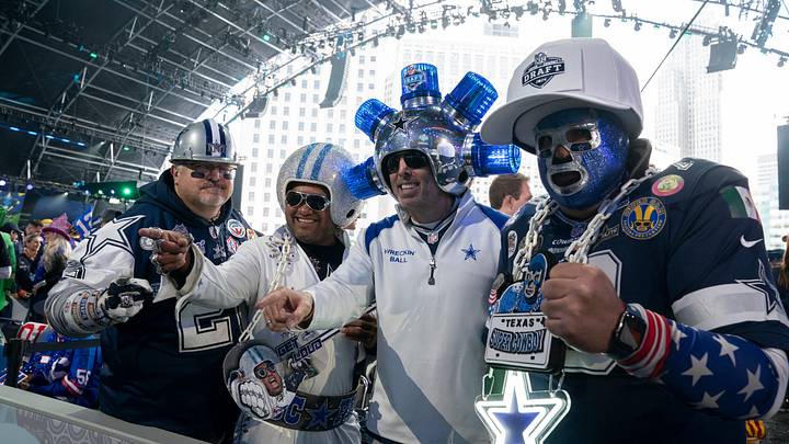 Dallas Cowboys fans pose in the main theater for the first day of the NFL Draft in Detroit. Dallas Cowboys fans pose in the main theater for the first day of the NFL Draft in Detroit.
