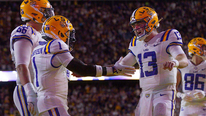 Sep 28, 2024; Baton Rouge, Louisiana, USA;  LSU Tigers wide receiver Aaron Anderson (1) celebrates a touchdown with quarterback Garrett Nussmeier (13) against the South Alabama Jaguars during the first quarter at Tiger Stadium. Mandatory Credit: Stephen Lew-Imagn Images