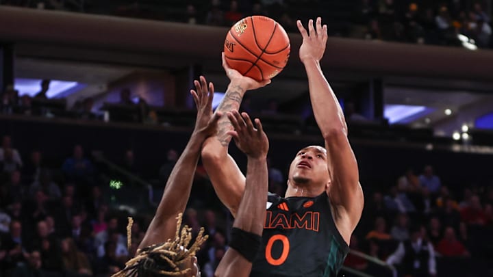Dec 10, 2024; New York, New York, USA;  Miami  Hurricanes guard Matthew Cleveland (0) and Tennessee Volunteers guard Jahmai Mashack (15) at Madison Square Garden. Mandatory Credit: Wendell Cruz-Imagn Images