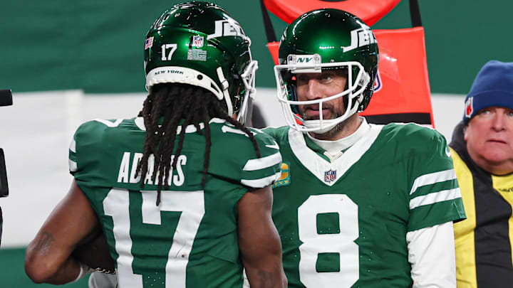 Jan 5, 2025; East Rutherford, New Jersey, USA; New York Jets quarterback Aaron Rodgers (8) and wide receiver Davante Adams (17) celebrates after a touchdown during the second half against the Miami Dolphins at MetLife Stadium. Mandatory Credit: Vincent Carchietta-Imagn Images Jan 5, 2025; East Rutherford, New Jersey, USA; New York Jets quarterback Aaron Rodgers (8) and wide receiver Davante Adams (17) celebrates after a touchdown during the second half against the Miami Dolphins at MetLife Stadium. Mandatory Credit: Vincent Carchietta-Imagn Images