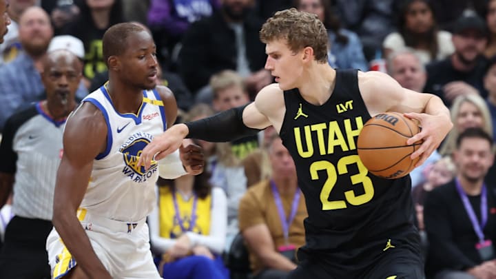 Oct 25, 2024; Salt Lake City, Utah, USA; Utah Jazz forward Lauri Markkanen (23) posts up on Golden State Warriors forward Jonathan Kuminga (00) during the second quarter at Delta Center. Mandatory Credit: Rob Gray-Imagn Images