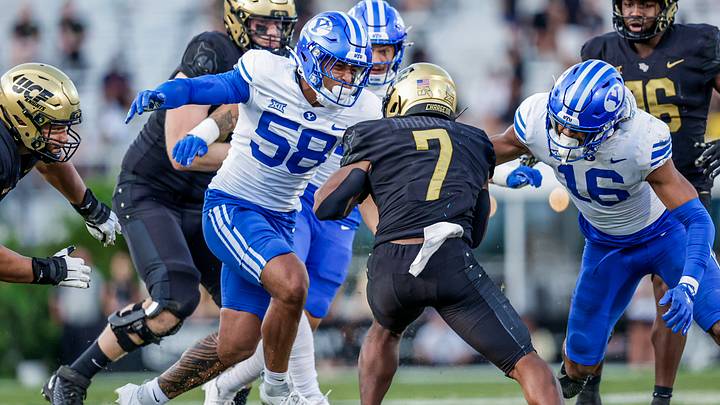 BYU linebackers Isaiah Glasker and Aisea Moa make a tackle against UCF BYU linebackers Isaiah Glasker and Aisea Moa make a tackle against UCF