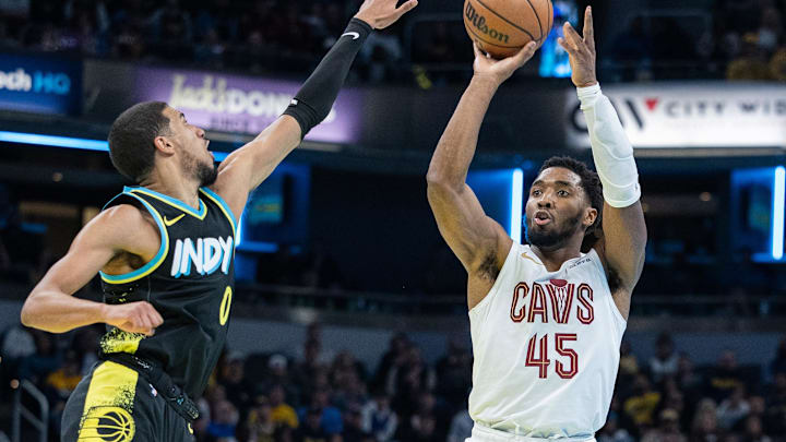 Nov 3, 2023; Indianapolis, Indiana, USA; Cleveland Cavaliers guard Donovan Mitchell (45) shoots while Indiana Pacers guard Tyrese Haliburton (0) defends in the second half at Gainbridge Fieldhouse. Mandatory Credit: Trevor Ruszkowski-Imagn Images Nov 3, 2023; Indianapolis, Indiana, USA; Cleveland Cavaliers guard Donovan Mitchell (45) shoots while Indiana Pacers guard Tyrese Haliburton (0) defends in the second half at Gainbridge Fieldhouse. Mandatory Credit: Trevor Ruszkowski-Imagn Images