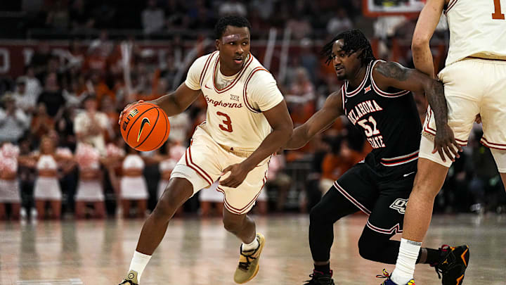 Texas Longhorns guard Max Abmas (3) pushes past Oklahoma State guard John-Michael Wright (51) during
