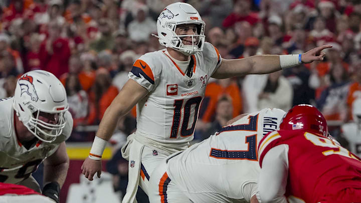 Dec 25, 2025; Kansas City, Missouri, USA; Denver Broncos quarterback Bo Nix (10) gestures on the line of scrimmage during the first quarter at GEHA Field at Arrowhead Stadium.