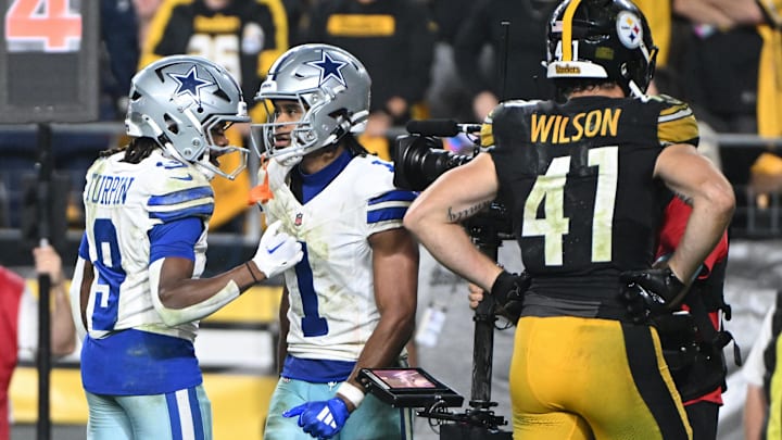 Dallas Cowboys wide receiver Jalen Tolbert celebrates with KaVontae Turpin after scoring a touchdown in front of Pittsburgh Steelers linebacker Payton Wilson.