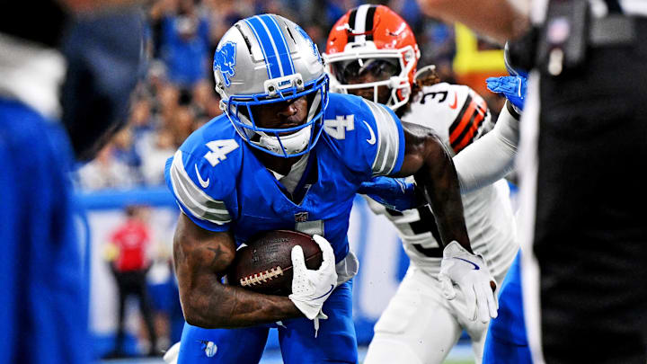 Detroit Lions cornerback D.J. Reed (4) runs the ball during the first half against the Cleveland Browns at Ford Field.