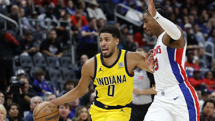 Oct 23, 2024; Detroit, Michigan, USA;  Indiana Pacers guard Tyrese Haliburton (0) dribbles on Detroit Pistons guard Jaden Ivey (23) in the second half at Little Caesars Arena. Mandatory Credit: Rick Osentoski-Imagn Images