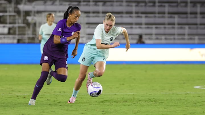 Orlando Pride forward Adriana Leal da Silva (9) dribbles the ball against NJ/NY Gotham FC midfielder Jenna Nighswonger (2)  