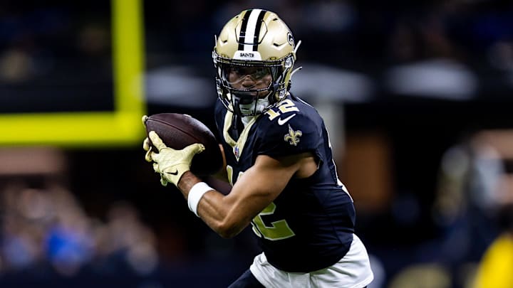 Dec 3, 2023; New Orleans, Louisiana, USA; New Orleans Saints wide receiver Chris Olave (12) catches a pass against the Detroit Lions during the first half at the Caesars Superdome. Mandatory Credit: Stephen Lew-USA TODAY Sports Dec 3, 2023; New Orleans, Louisiana, USA; New Orleans Saints wide receiver Chris Olave (12) catches a pass against the Detroit Lions during the first half at the Caesars Superdome. Mandatory Credit: Stephen Lew-USA TODAY Sports