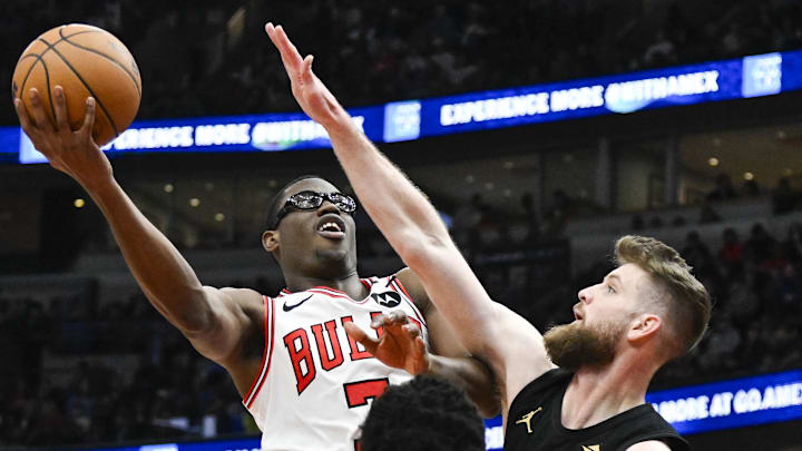 Mar 4, 2025; Chicago, Illinois, USA;  Chicago Bulls forward Jalen Smith (7) shoots past Cleveland Cavaliers forward Dean Wade (32) during the first half at United Center. Mandatory Credit: Matt Marton-Imagn Images