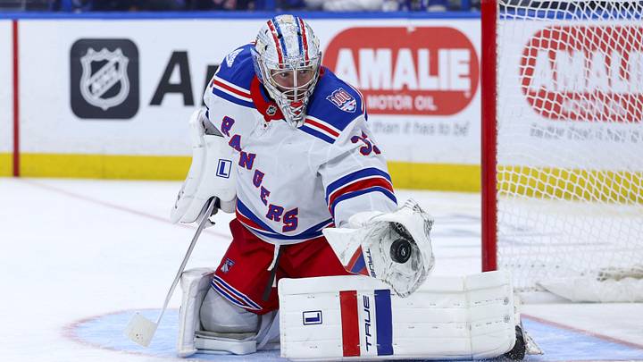 Apr 15, 2026; Tampa, Florida, USA; New York Rangers goaltender Dylan Garand (33) makes a save against the Tampa Bay Lightning in the third period at Benchmark International Arena. 