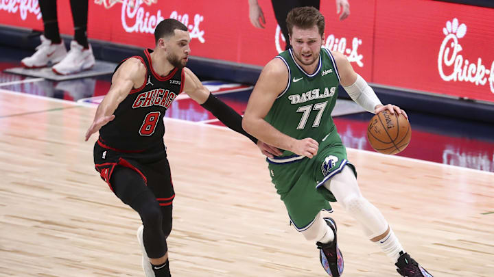 Dallas Mavericks guard Luka Doncic (77) drives to the basket as Chicago Bulls guard Zach LaVine (8) defends during the second half at American Airlines Center. Mandatory Credit: Kevin Jairaj-Imagn Images