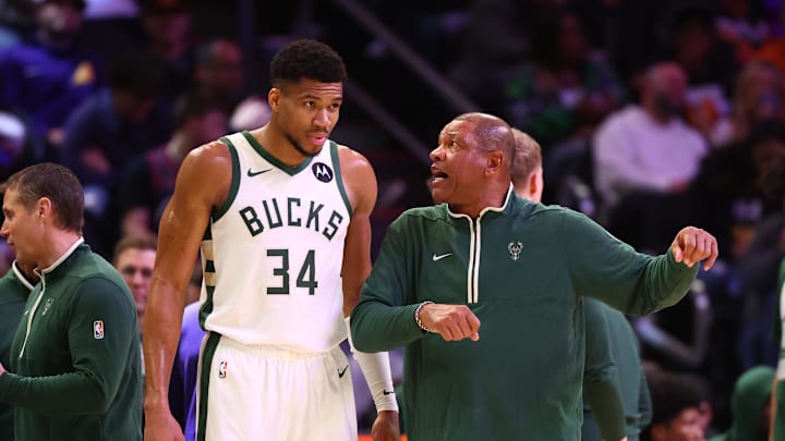 Feb 6, 2024; Phoenix, Arizona, USA; Milwaukee Bucks head coach Doc Rivers talks to forward Giannis Antetokounmpo (34) against the Phoenix Suns at Footprint Center. Mandatory Credit: Mark J. Rebilas-Imagn Images
