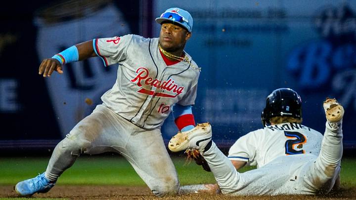 Akron infielder Alex Mooney (2) is tagged out at second base by Reading infielder Aroon Escobar (10) on a steal attempt during the home opening day game, April 2, 2026, in Akron, Ohio. Akron infielder Alex Mooney (2) is tagged out at second base by Reading infielder Aroon Escobar (10) on a steal attempt during the home opening day game, April 2, 2026, in Akron, Ohio.