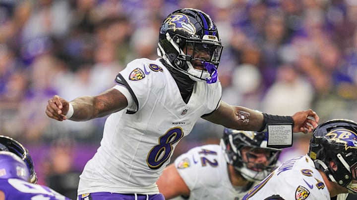 Nov 9, 2025; Minneapolis, Minnesota, USA; Baltimore Ravens quarterback Lamar Jackson (8) under center against the Minnesota Vikings in the fourth quarter at U.S. Bank Stadium. Mandatory Credit: Brad Rempel-Imagn Images